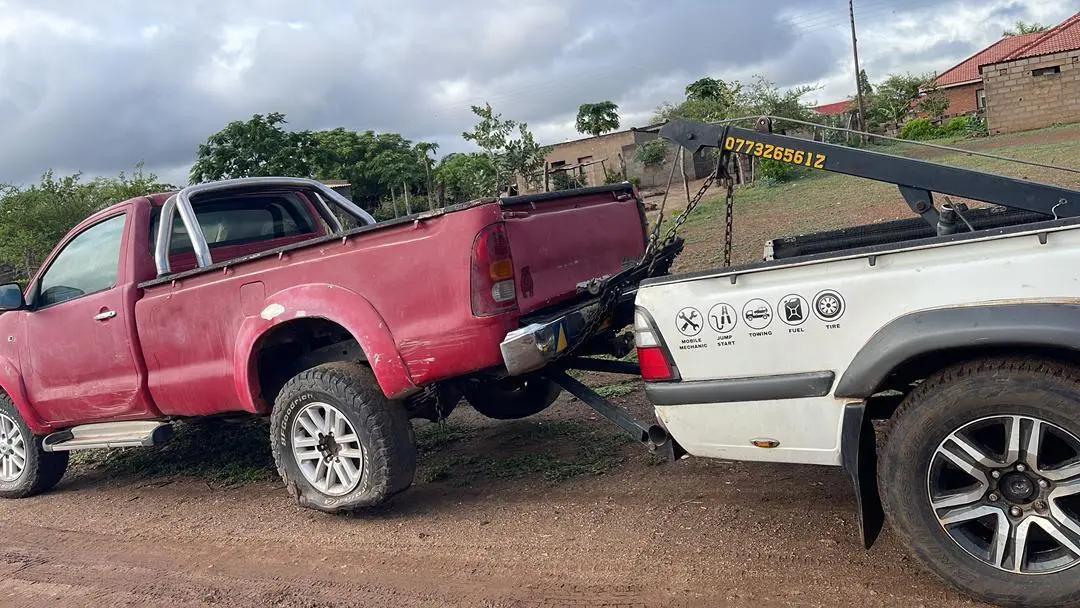 Red pickup being recovered by Billy Towing
